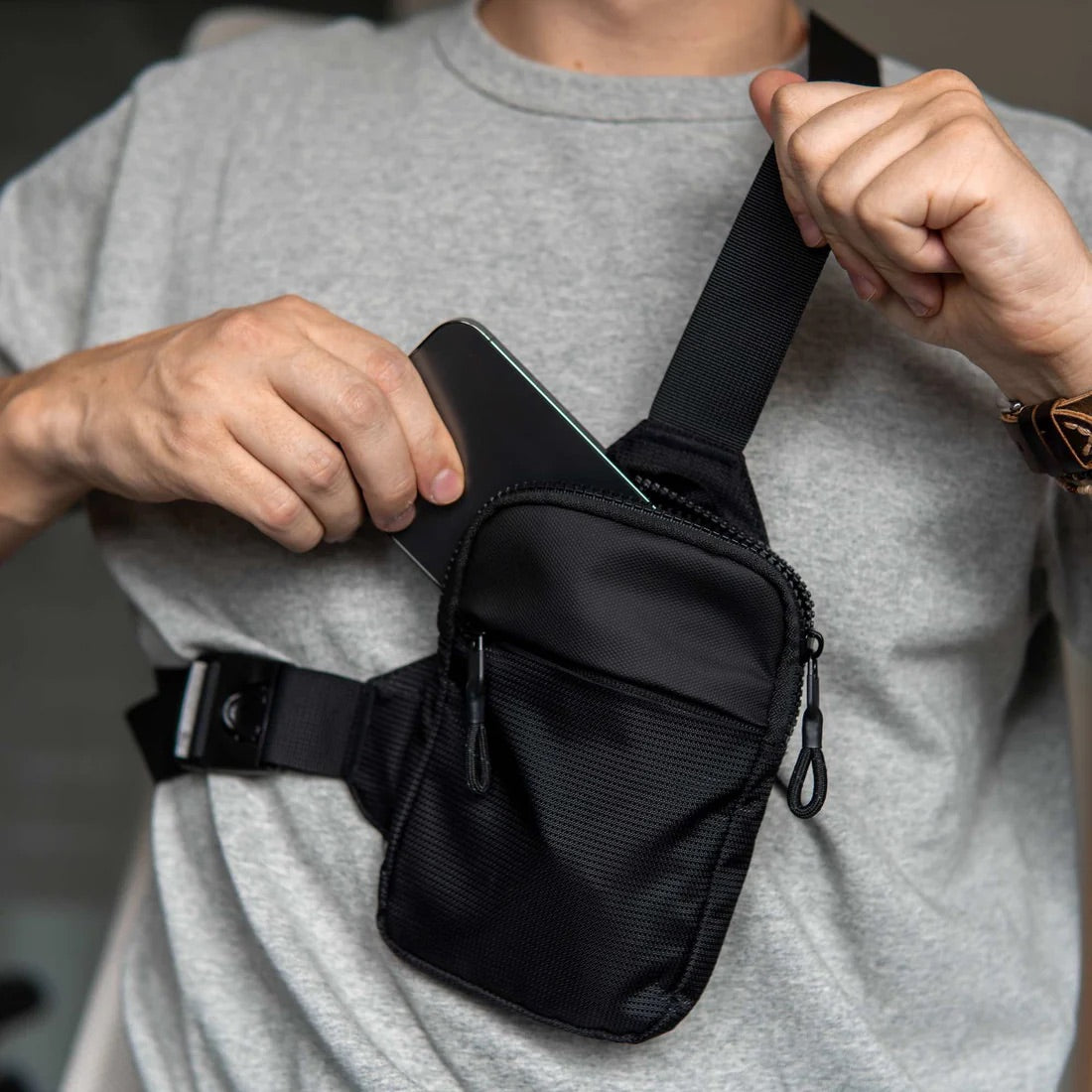 Person Holding Travel Sling Bag