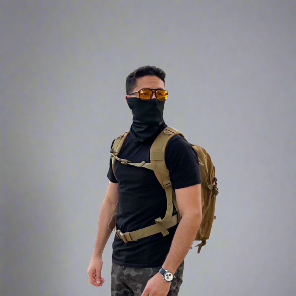 A traveler wearing nomad bandana, urban army sunglasses and military style "Journey" backpack.